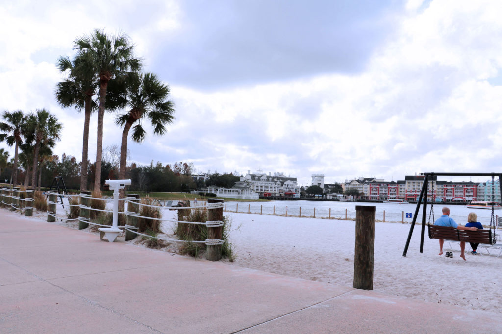 Disney DVC Beach Club Villas view of Boardwalk on sandy beach with swing